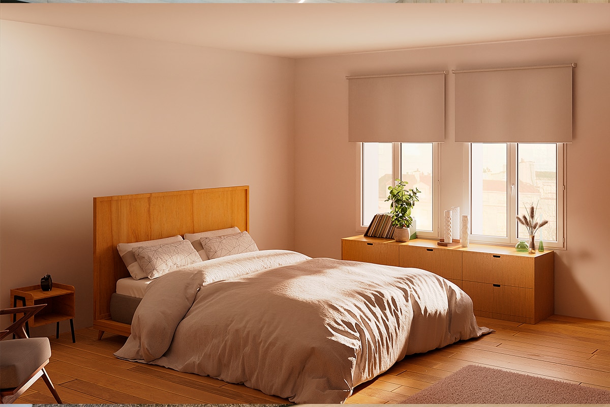 Bedroom with large bed in the center and rolling shades covering the windows behind it.