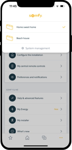 TaHoma by Somfy App screenshot showing a user selecting between two systems they have setup in the app. The first is named 'Home sweet home' and the second is named 'Beach house'.