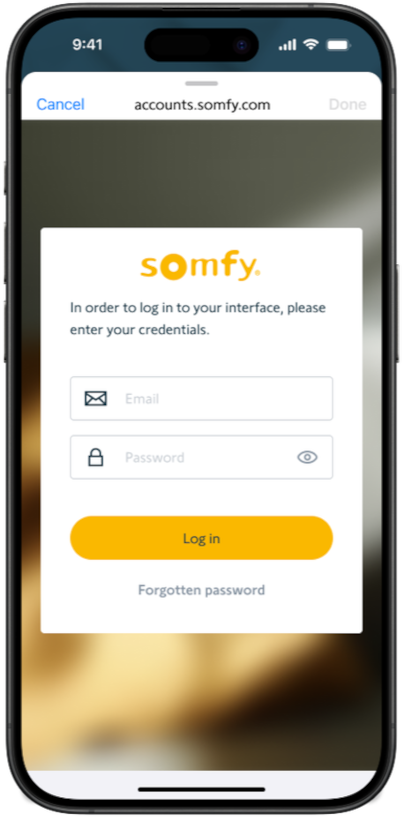 Login screen of the TaHoma by Somfy application shown on a mobile phone.